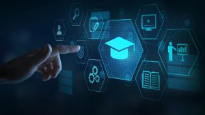 A hand pointing at a digital interface with various icons representing education and learning, including a graduation cap, gears, a target, a book, a person giving a presentation, and a computer screen with a play button. The interface, designed for Education App Development, is set against a dark background with hexagonal shapes highlighting each icon.